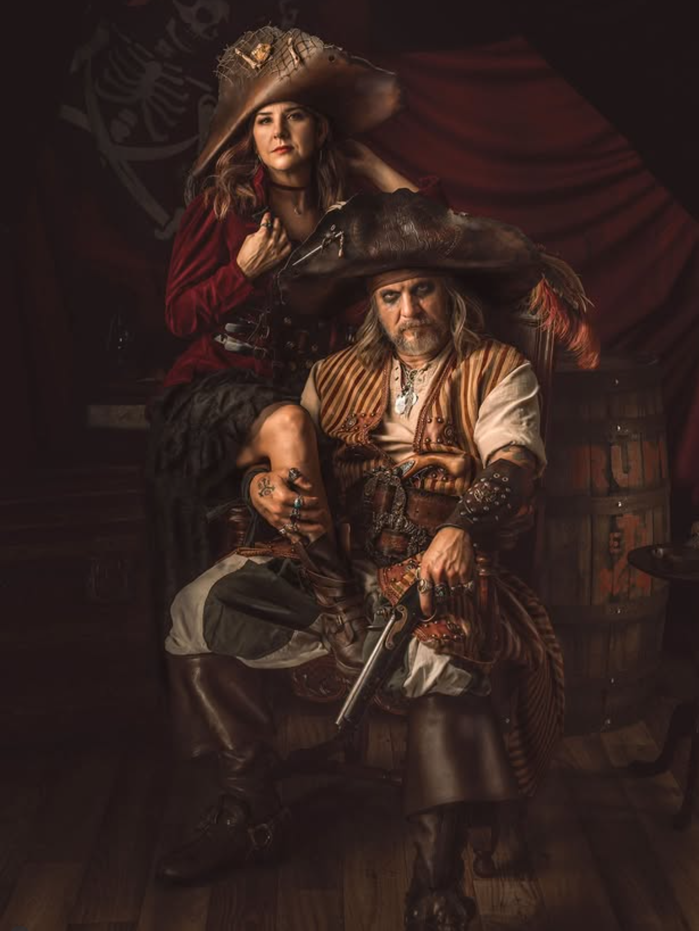 Pirate themed fine art portrait of two people in period costumes